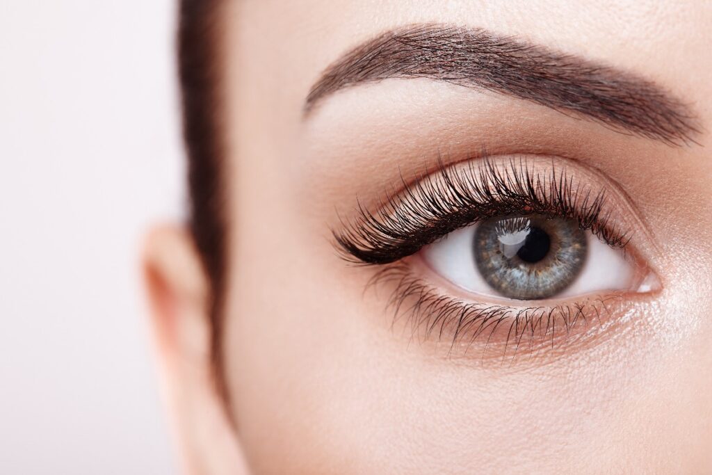 Female eye with long false eyelashes jpg